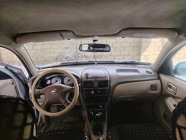 Nissan Sunny: 1.3 л | 2006 г. Седан — 5