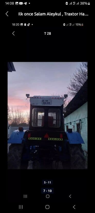 Mavi rəngdə olan T-28 markalı traktor satılır. Kabinədə oturacaqlar və