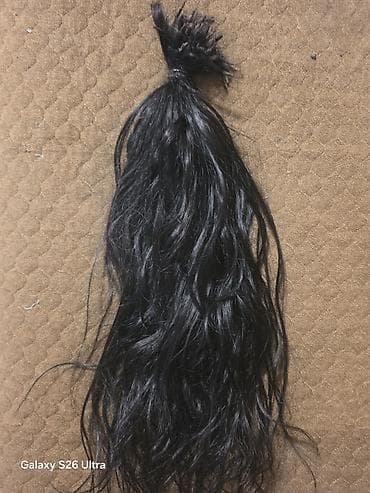 Qara təbii saç dəstəsi – topuz şəklində bağlanmış - Material: təbii