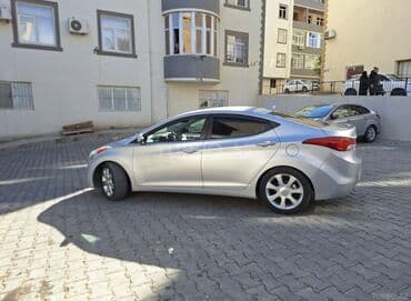 Volkswagen: Hyundai Elantra: 1.6 л | 2012 г. Седан — 5