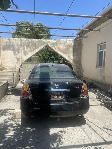 Nissan Altima: 2.5 l | 2005 il Sedan — 2