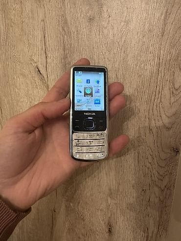 philips xenium x700: Nokia 6700 Slide, rəng - Gümüşü, Düyməli — 1