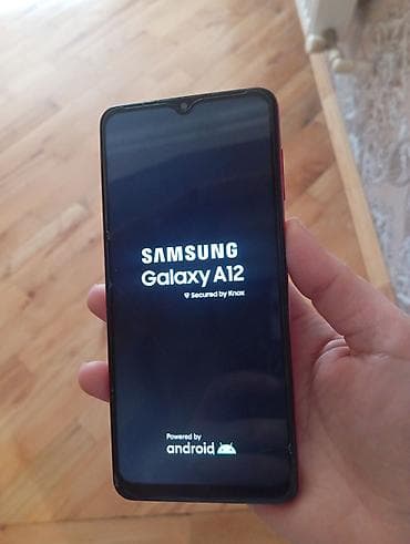 azercell modem internet paketleri: Qırmızı korpuslu smartfon - Ön hissədə damla tipli kamera çıxıntısı — 7