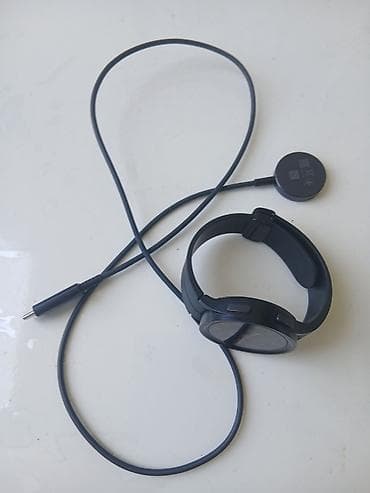 galaxy watch: Samsung Galaxy Watch (qara), maqnitli USB‑C simli şarj cihazı ilə — 2