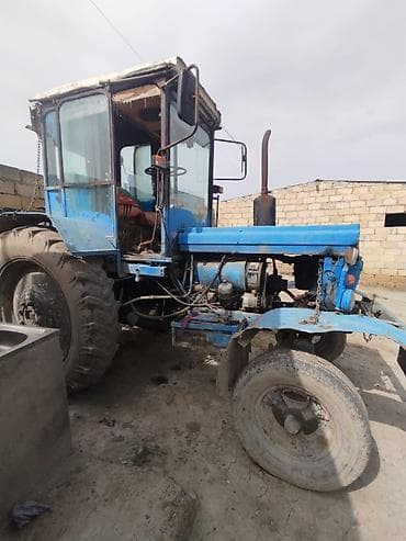 İstehsal avadanlığı: Mavi rəngli MTZ tipli təkərli traktor - Güc aqreqatı: dörd silindrli — 6