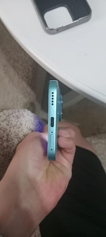 dinamikleri: Məhsul: Mavi rəngdə smartfon + qoruyucu keyfiyyətli örtük (şəkillərdə — 4