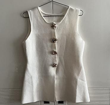 Ağ rəngli qadın jileti.
 Yenidir