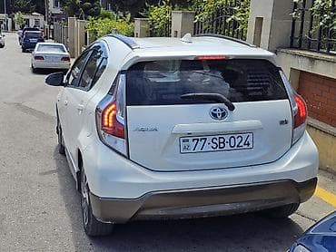 kia optima r18: Toyota Aqua Hybrid, ağ rəng, hetçbek gövdə. Əsas xüsusiyyətlər: - — 3