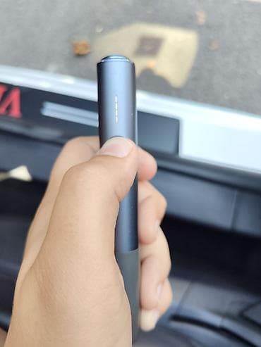 IQOS ILUMA ONE tütün qızdırma cihazı, tünd boz rəngdə və kompakt, oval — 1