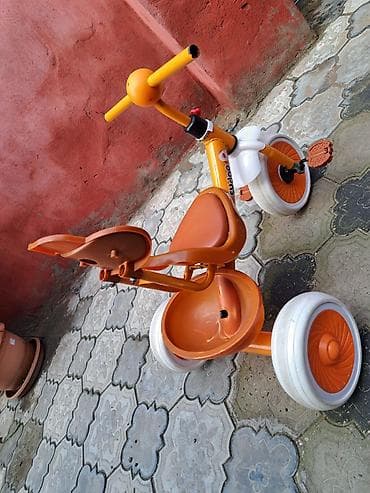 3 təkər velosiped: Uşaq üçtəkərli velosiped – narıncı rəngdə. Xüsusiyyətlər: - 3 təkərli — 2