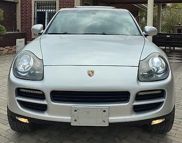 mitsubishi lancer evolution: Porsche Cayenne (1-ci nəsil) – gümüşü rəngdə premium SUV. İli 2008 — 2