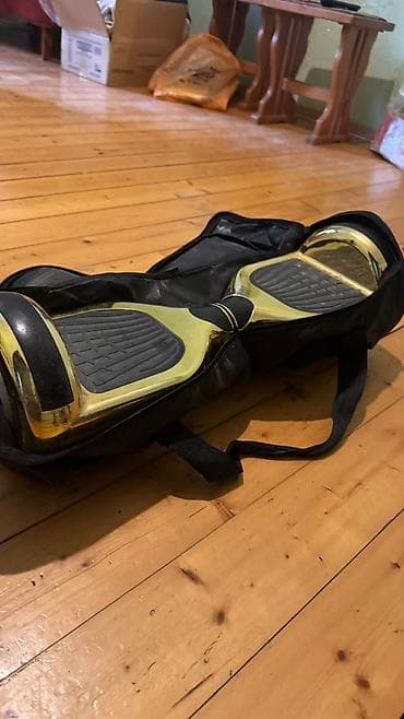 elekt: Qızılı rəngdə iki təkərli hoverboard (self-balance skuter) — 2