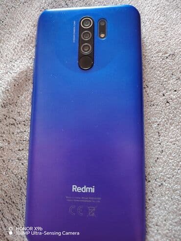 muzukalni centir: Redmi mobil telefonu parlaq firuzəyi rəngdədir və dördlü kamera — 4