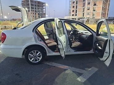 brabus disk: Nissan Sunny: 1.3 l | 2008 il Sedan — 3
