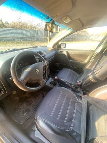 oka satılır: Model: Opel Astra Caravan (universal kuzov) Rəng: tünd boz Yanacaq — 2