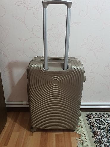 Velosipedlər: Sərnişin çamadanı – sərt korpuslu, spiral naxışlı, qızılı-bej rəng. - — 1