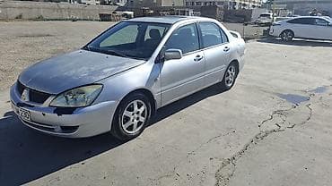 ford focus hatchback: Mitsubishi Lancer: 1.6 l | 2006 il 466000 km Sedan — 7