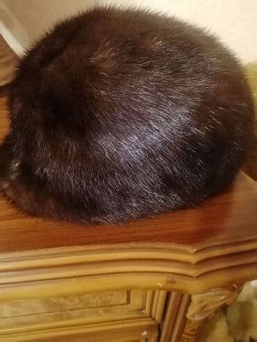 Qəhvəyi rəngdə xəz papaq(norka). 2dəfə istifadə olunub olcu uygun