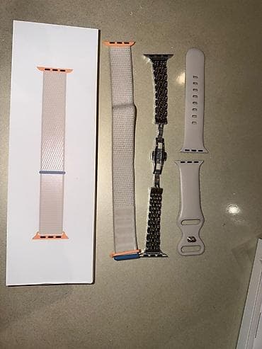mac mini: Apple Watch – gümüşü alüminium korpus, ağ/süd rəngli silikon qayış — 5