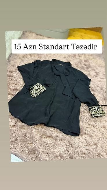 - Qara şifon bluz: Qollarında zərif naxışlı manjet detalları, ön