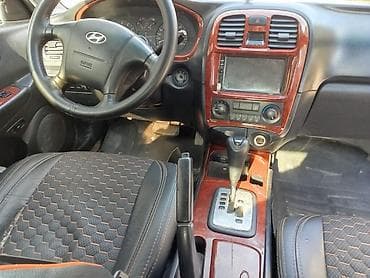 suktur: Hyundai Elantra (J3) sedan, gümüşü rəng. - Kuzov: 4 qapılı sedan — 5