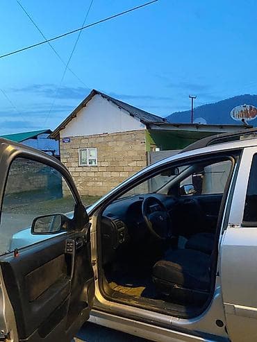 kia sportage 1: Opel Astra Caravan (universalı) - Korpus: universal kuzov, gümüşü — 3