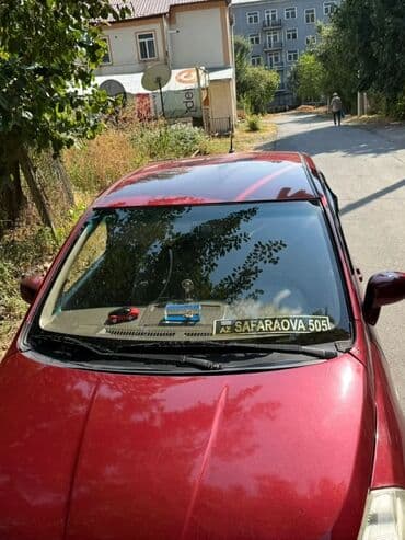 дом на колесах turbo az: Tünd qırmızı rəngli Nissan Tiida avtomobili, gündəlik istifadə üçün — 1