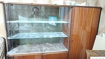 Şüşəli dolab vitrini, İşlənmiş, Ünvandan götürmə