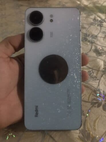 redmi note 15 pro max qiyməti: Redmi markalı smartfon. Telefonun arxa tərəfində "Redmi" loqosu və — 4