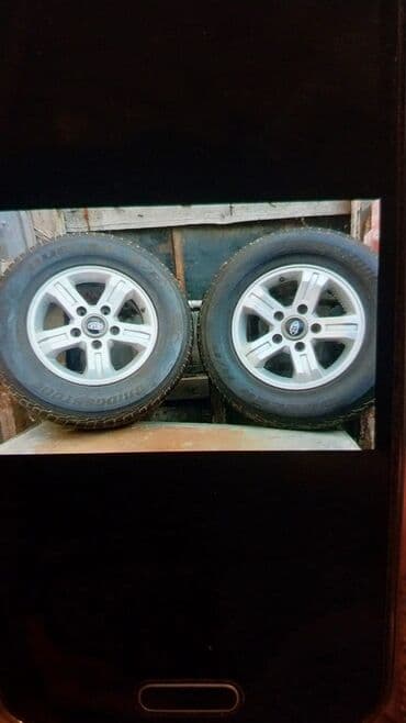 Lixiang: Məhsul: Kia orijinal yüngül lehimli disklər və Bridgestone Dueler H/T — 2