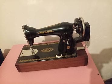 qoz ceken masin: Mexanik tikiş maşını – klassik model, əl qolu ilə işləyir — 1