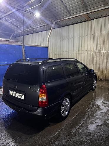 stanqa: Opel Astra Caravan (universał) – qara rəng, 5 qapı, geniş baqajlı ailə — 7