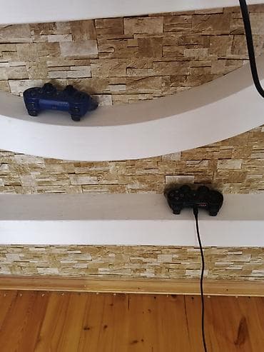 divarda televizor yeri: Sony PlayStation 3 (PS3) Slim oyun konsolu - Rəng: Qara - Korpus: PS3 — 2