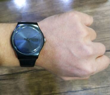 irshad telecom is saatlari: Saat Swatch orginaldi.
Hec bir problemi yoxdu islekdi — 1