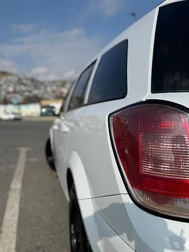 afdomobil: Opel Astra Caravan (Universal) - Kuzzov: universal (Caravan), ağ rəng — 7