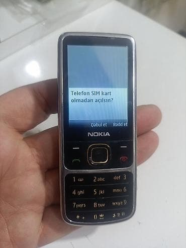 Nokia 6700 Slide, rəng - Gümüşü, Düyməli