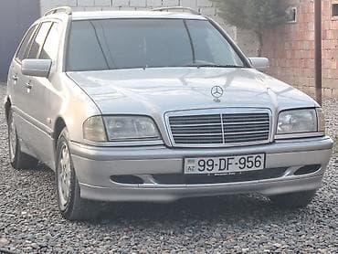 opel astra k: Mercedes-Benz C‑Class Universal (W202) – gümüş rəngli stansiyon vaqon — 1