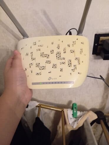 ruter modem: TP-Link şirkətinin istehsalı olan, iki antenli ağ ruter. Evdə və ya — 1