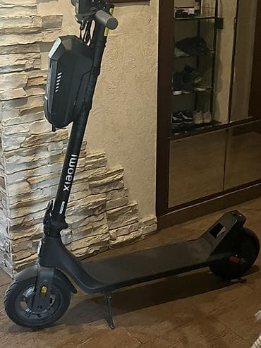 electro gitara: Xiaomi elektrik skuter. Şəkillərdə qara rəngli, minimalist dizayna — 2