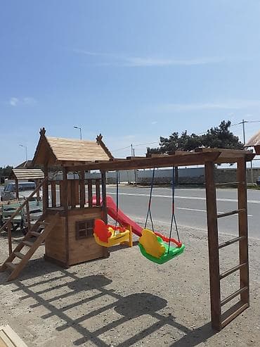 Uşaq oyun kompleksi – taxta evciyik və sallanan yelləncəklərlə -