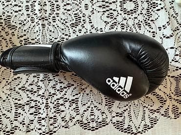 Adidas markalı, qara rəngdə tam dəri boks əlcəkləri satılır. Tam — 1