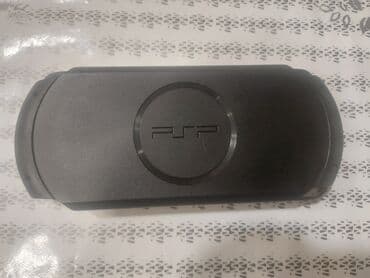 psp сколько стоит: PSP əl oyun konsolu. Cihazın ekranında "Call of Duty" və "Need for — 2