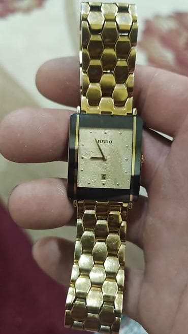 RADO kişi qol saatı - Korpus: düzbucaqlı forma, qara çərçivəli qızılı