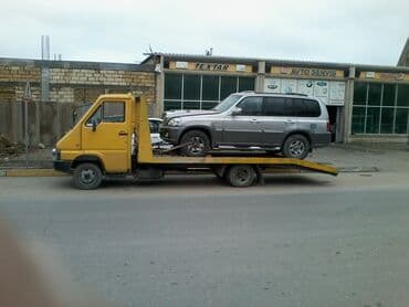 купить грузовой эвакуатор: Sarı rəngli evakuator, nəqliyyat vasitələrini daşımaq üçün nəzərdə — 9