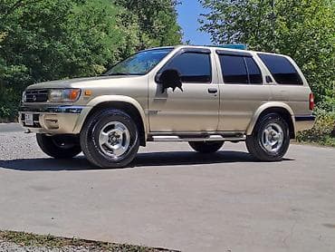 mondial drift 150: Nissan Pathfinder (R50) SUV - Kuzov: 5 qapılı, qızılı rəng, yandan — 1