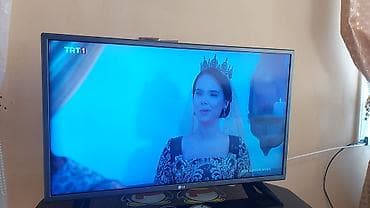 televizo: LG televizor + şüşə TV stendi - 82 Ekran - Pultu var Televizor — 1