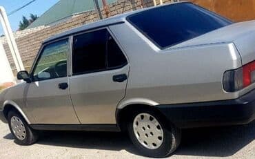 Model: Sedan, 4 qapı Rəng: Gümüşü (metalik) Kuzov: Künc xətli