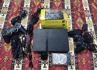 Ps2 idiyal vaziyyatda usdunde 3 pult verilir içinde 250 çox oyun