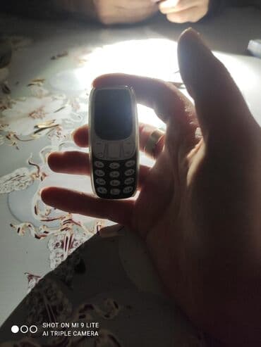 fly телефон раскладушка с большими кнопками: Ultra-mini klassik düyməli telefon - Çox kiçik ölçü: ovuca sığan — 2