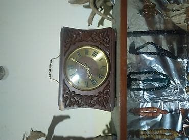 Mövzu: Antik dekor kolleksiyası – saatlar və taxta yelkənli gəmi